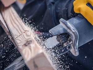 Image of a reciprocating saw cutting wood
