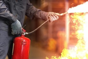 Man extinguishing a fire